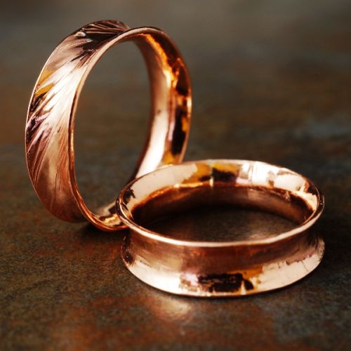 Handcrafted recycled copper anticlastic rings